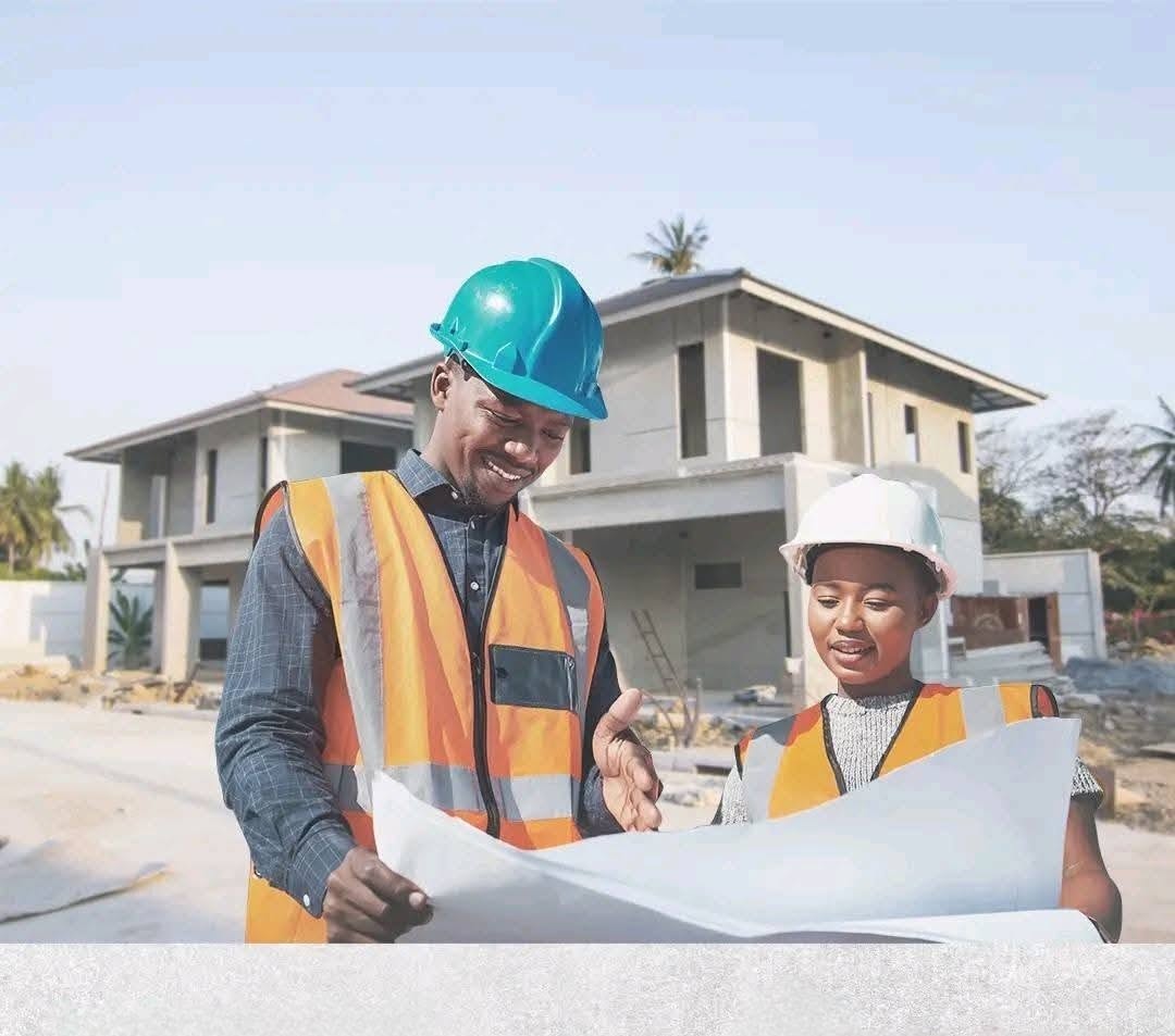 Contractors reviewing blueprints on a Simba Cement build site